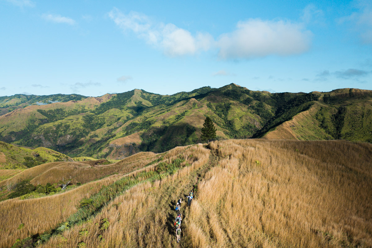 Hiking group through Fiji Highlands via a drone