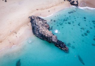 Cliff jumping in Waimea Bay Oahu Hawaii