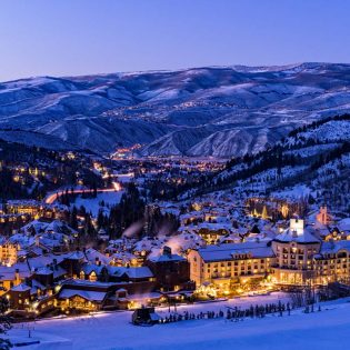 Beaver Creek Resort Winter Skiing at Dusk - Scenic view of village illuminated at night with ski runs.