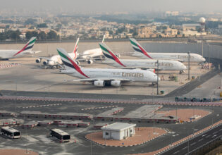 Emirates airplanes parked at Dubai International Airport