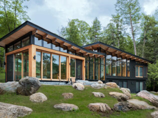 Exterior of Barlochan Cottage in Torrance, located on Walkers Point on the west shore of Lake Muskoka, Ontario, Canada. The Heated Rivalry cottage