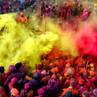 People celebrating in colour at the Holi Festival