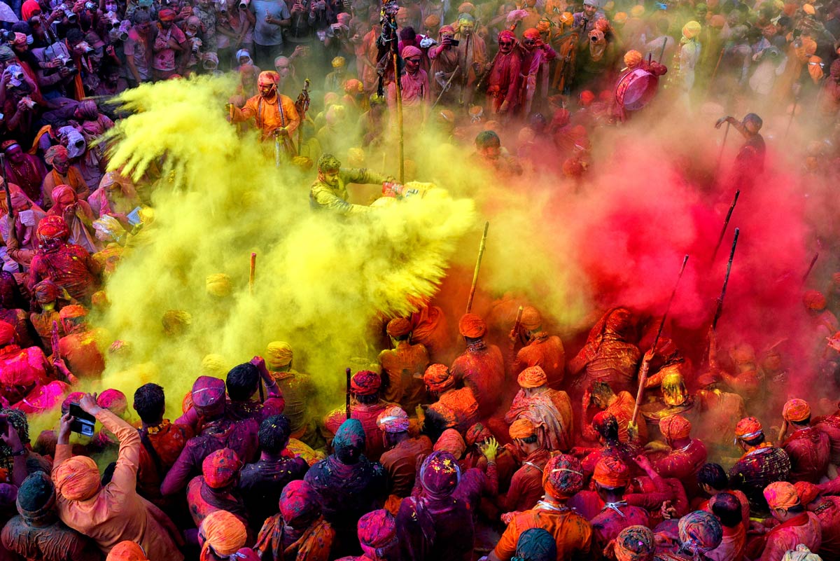 People celebrating in colour at the Holi Festival