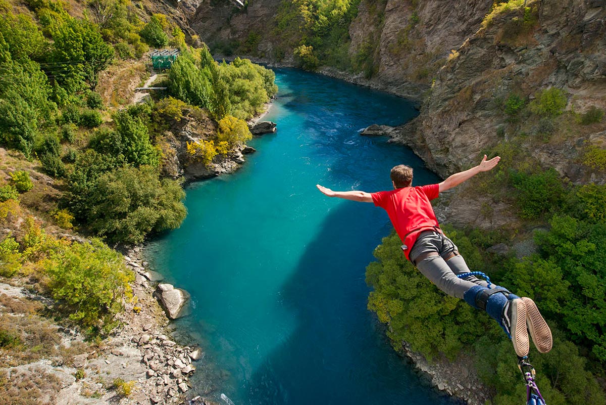 Man doing bungee jump from Kawarau Bridge Bungy in Queenstown, New Zealand