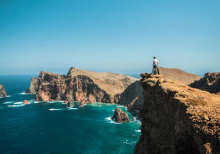 Man standing on cliff in Madeira