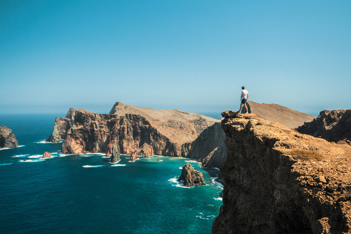 Man standing on cliff in Madeira