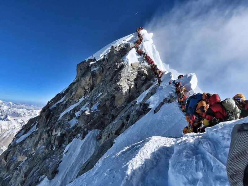 People queuing to reach Mount Everest Summit/Top of the World / Highest Mountain in the Himalayas Nepal