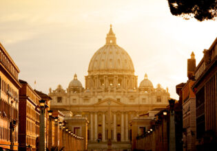 St. Peter's Basilica at sunset from Via della Conciliazione. Vatican City State. Rome, Italy.