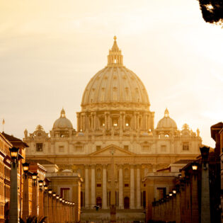 St. Peter's Basilica at sunset from Via della Conciliazione. Vatican City State. Rome, Italy.