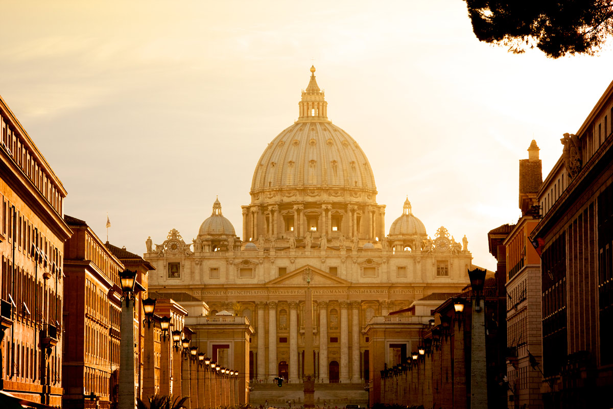 St. Peter's Basilica at sunset from Via della Conciliazione. Vatican City State. Rome, Italy.