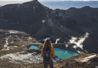 A woman gazing at the striking view of Mt Ngauruhoe.