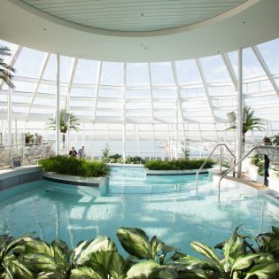an indoor pool onboard Royal Caribbean Quantum of the Seas