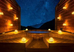 bright lamps surrounding Onsen Hot Pools at night