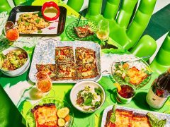 a wide selection of dishes on the green table at Shuggie’s Trash Pie and Natural Wine Bar