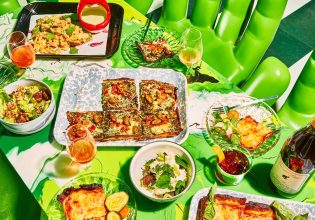 a wide selection of dishes on the green table at Shuggie’s Trash Pie and Natural Wine Bar