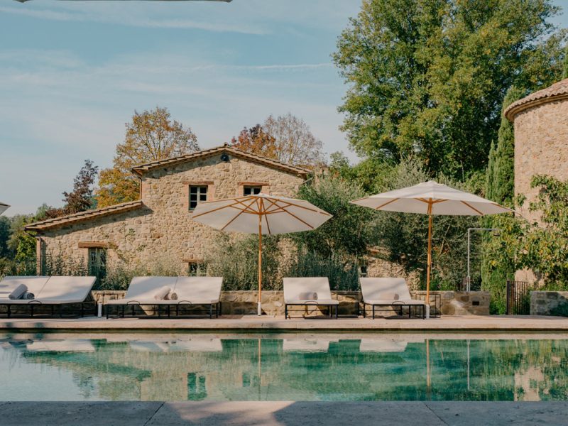 an outdoor pool with sun loungers at Vocabolo Mosacatelli