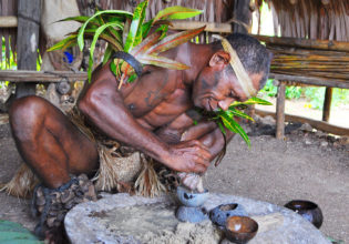 Chief making kava at Leweton Cultural Village, Vanuatu.