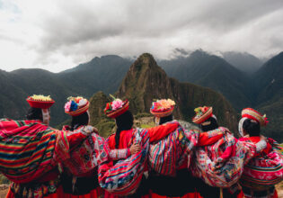 Quechua women from the Sacred Valley with arms linked