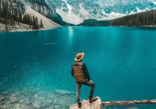 Man stands beside Moraine Lake