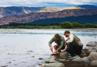 Fishing for trout in Wairau River, Marlborough.