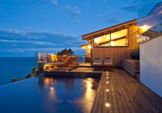 Split Apple Retreat - set high on a cliff-face on the seaside border of Abel Tasman National Park, on New Zealand’s South Island.